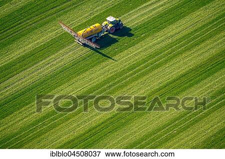 Tractor with pesticide sprayer, environmental toxins, fertilizing, Holsterhausen, Dorsten, Ruhr district, North Rhine-Westphalia, Germany, Europe View Large Photo Image Stock Photo - Tractor with pesticide sprayer, environmental toxins, fertilizing, Holsterhausen, Dorsten, Ruhr district, North Rhine-Westphalia, Germany, Europe. Fotosearch