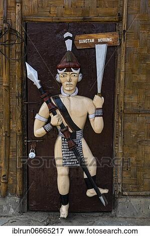 Stock Photo - Traditional artist woodwork in the Naga heritage village Kisama, Nagaland, India, Asia. Fotosearch
