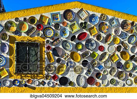 Traditional Portuguese ceramics, plates and dishes on the wall of a pottery, Raposeira, Vila do Bispo, Faro District, Portugal, Europe View Large Photo Image Picture - Traditional Portuguese ceramics, plates and dishes on the wall of a pottery, Raposeira, Vila do Bispo, Faro District, Portugal, Europe. Fotosearch
