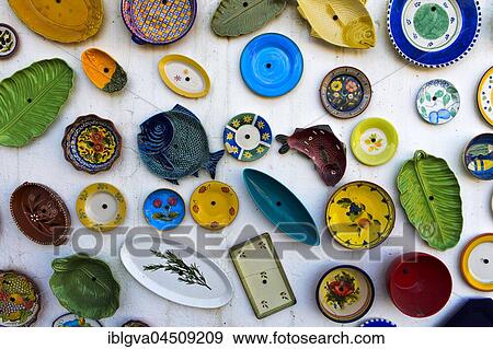 Traditional Portuguese ceramics, plates and dishes on the wall of a pottery, Raposeira, Vila do Bispo, Faro District, Portugal, Europe View Large Photo Image Stock Photo - Traditional Portuguese ceramics, plates and dishes on the wall of a pottery, Raposeira, Vila do Bispo, Faro District, Portugal, Europe. Fotosearch