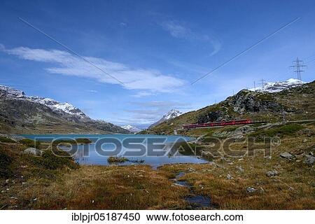 Train of the Rhaetian Railway at Lago Bianco, Bernina, Upper Engadine, Engadine, Switzerland, Europe View Large Photo Image Stock Image - Train of the Rhaetian Railway at Lago Bianco, Bernina, Upper Engadine, Engadine, Switzerland, Europe. Fotosearch