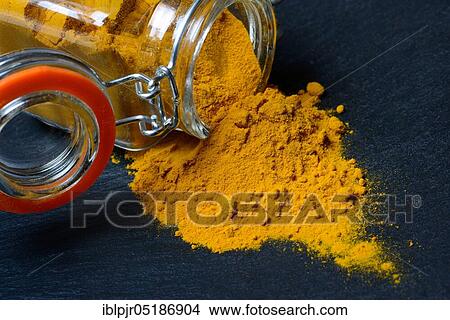 Turmericpowder ( Curcuma longa) with glass vessel View Large Photo Image Picture - Turmericpowder ( Curcuma longa) with glass vessel. Fotosearch