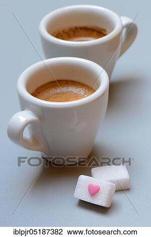 Two cups of espresso with sugar cubes, sugar heart View Large Photo Image Stock Image - Two cups of espresso with sugar cubes, sugar heart. Fotosearch