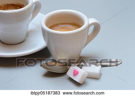 Two cups of espresso with sugar cubes and coffee spoon, sugar heart View Large Photo Image Stock Image - Two cups of espresso with sugar cubes and coffee spoon, sugar heart. Fotosearch