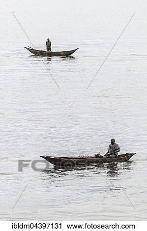Two fishermen in a pirogue, logboat, Kribi, Southern Region, Cameroon, Africa View Large Photo Image Stock Image - Two fishermen in a pirogue, logboat, Kribi, Southern Region, Cameroon, Africa. Fotosearch