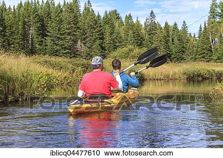 Two men paddling in a kayak, Madawaska River, Algonquin Provincial Park, Ontario Province, Canada, North America View Large Photo Image Stock Image - Two men paddling in a kayak, Madawaska River, Algonquin Provincial Park, Ontario Province, Canada, North America. Fotosearch