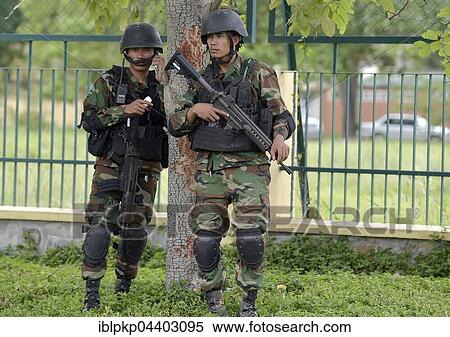Stock Photography - Two soldiers of the Cambodian army with sub-machine guns, Phnom Penh, Cambodia, Asia. Fotosearch