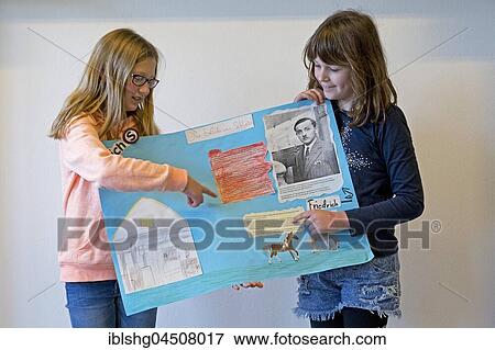 Two students with poster giving a presentation, primary school, Lower Saxony, Germany, Europe View Large Photo Image Stock Photo - Two students with poster giving a presentation, primary school, Lower Saxony, Germany, Europe. Fotosearch