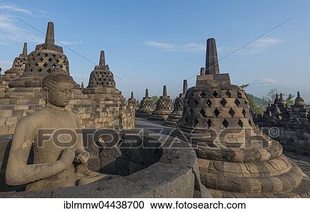 Stock Image - Uncovered Buddha statue at Borobudur Temple, stupas, Borobudur, Yogyakarta, Java, Indonesia, Asia. Fotosearch