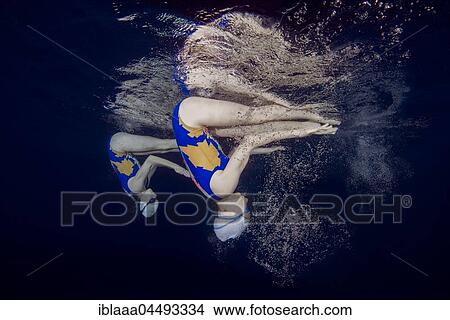 Underwater view of Synchronized Swimming in a swimming pool, Ukraine, Europe View Large Photo Image Picture - Underwater view of Synchronized Swimming in a swimming pool, Ukraine, Europe. Fotosearch
