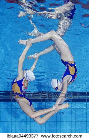 Underwater view of Synchronized Swimming in a swimming pool, Ukraine, Europe View Large Photo Image Stock Photo - Underwater view of Synchronized Swimming in a swimming pool, Ukraine, Europe. Fotosearch