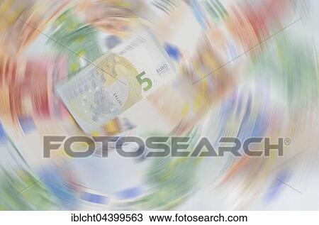 Stock Image - Various euro banknotes, 5 euros, circular blur. Fotosearch