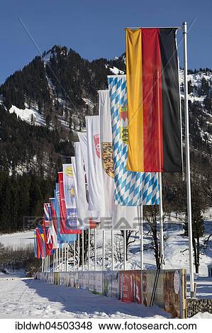 Stock Photo - Various flags, Nordic-Aktiv-Zentrum, Oberstdorf, Allgäu Alps, Allgäu, Bavaria, Germany, Europe. Fotosearch