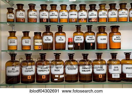 Stock Image - Various ingredients in glass for the production of medicines in a pharmacy. Fotosearch