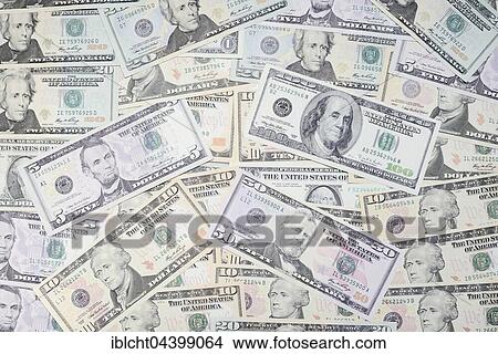 Various US dollar bills in a pile View Large Photo Image Picture - Various US dollar bills in a pile. Fotosearch
