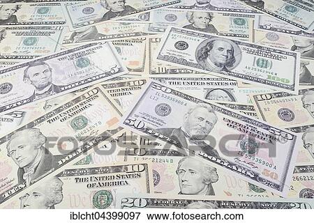 Various US dollar bills in a pile View Large Photo Image Stock Photo - Various US dollar bills in a pile. Fotosearch