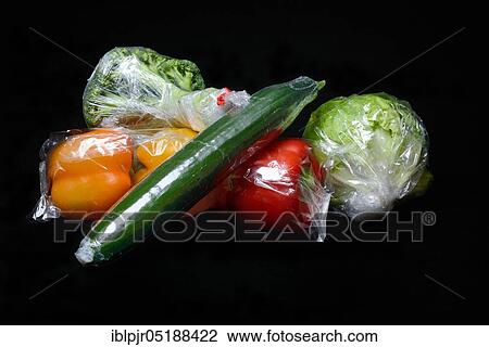 Vegetables in plastic packaging, cucumber View Large Photo Image Stock Image - Vegetables in plastic packaging, cucumber. Fotosearch
