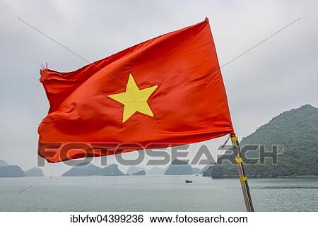 Vietnamese Flag, limestone rocks, karst mountains, Halong bay, Gulf of Tonkin, North Vietnam, Vietnam, Asia View Large Photo Image Stock Photograph - Vietnamese Flag, limestone rocks, karst mountains, Halong bay, Gulf of Tonkin, North Vietnam, Vietnam, Asia. Fotosearch