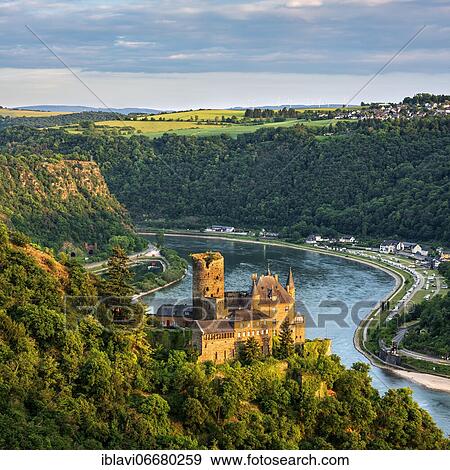 Stock Photo - View of Katz Castle on the Rhine, also Neukatzenelnbogen Castle, in the back the Loreley Rock, evening light, World Heritage Upper Middle Rhine Valley, St. Goarshausen, Rhineland-Palatinate, Germany, Europe. Fotosearch