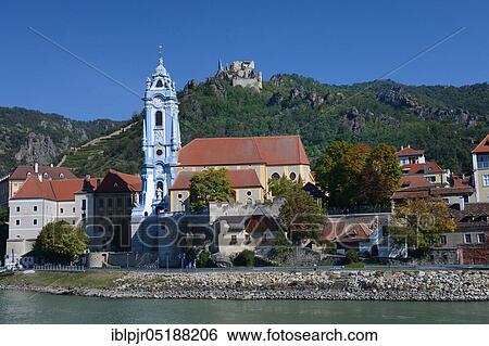 View over Danube, Dürnstein with collegiate church and castle ruins, Wachau, Austria, Europe View Large Photo Image Stock Photograph - View over Danube, Dürnstein with collegiate church and castle ruins, Wachau, Austria, Europe. Fotosearch