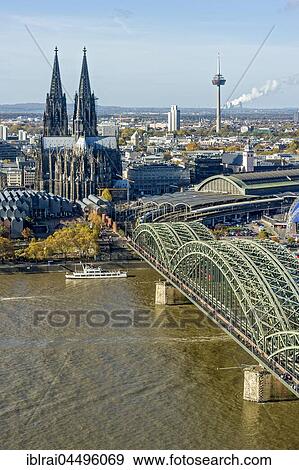 View over the river Rhine, Cologne's historic centre, Museum Ludwig, Cologne Cathedral, Hohenzollern Bridge, Central Station, behind TV tower Colonius, Cologne, North Rhine-Westphalia, Germany, Europe View Large Photo Image Stock Photo - View over the river Rhine, Cologne's historic centre, Museum Ludwig, Cologne Cathedral, Hohenzollern Bridge, Central Station, behind TV tower Colonius, Cologne, North Rhine-Westphalia, Germany, Europe. Fotosearch