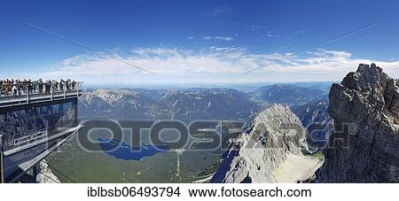 Viewing platform with tourists on the Zugspitze with view of the Eibsee lake and Allgäu, Bavaria, Germany, Europe View Large Photo Image Picture - Viewing platform with tourists on the Zugspitze with view of the Eibsee lake and Allgäu, Bavaria, Germany, Europe. Fotosearch