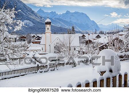 Stock Photo - Village view with parish church and Karwendel mountains, Wallgau, Werdenfelser Land, Upper Bavaria, Bavaria, Germany, Europe. Fotosearch