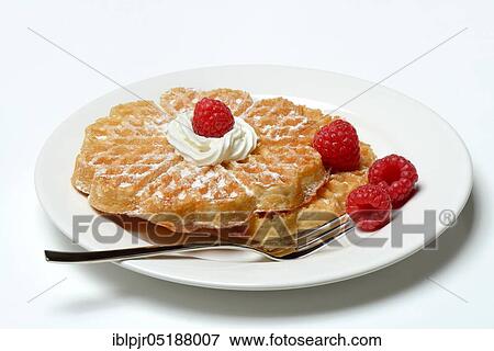 Stock Photo - Waffle with raspberries and whipped cream. Fotosearch