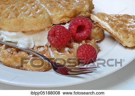 Waffle with raspberries and whipped cream View Large Photo Image Stock Photo - Waffle with raspberries and whipped cream. Fotosearch