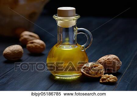 Walnut oil and walnuts ( Juglans regia) View Large Photo Image Stock Photography - Walnut oil and walnuts ( Juglans regia). Fotosearch