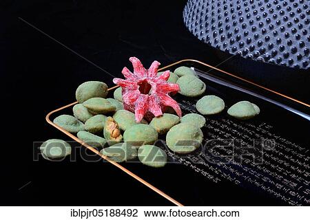 Wasabi peanuts and candied hibiscus flower, shell with Japanese characters, wasabi coat View Large Photo Image Stock Image - Wasabi peanuts and candied hibiscus flower, shell with Japanese characters, wasabi coat. Fotosearch