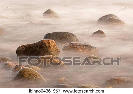 Water between stones on beach at coast, Denmark, Europe View Large Photo Image Stock Photo - Water between stones on beach at coast, Denmark, Europe. Fotosearch