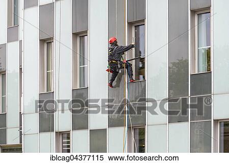 Stock Photography - Window cleaner on skyscraper façade, Hamburg, Germany, Europe. Fotosearch