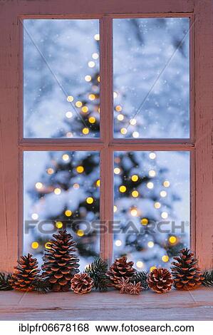Stock Photo - Window with view of illuminated Christmas tree. Fotosearch