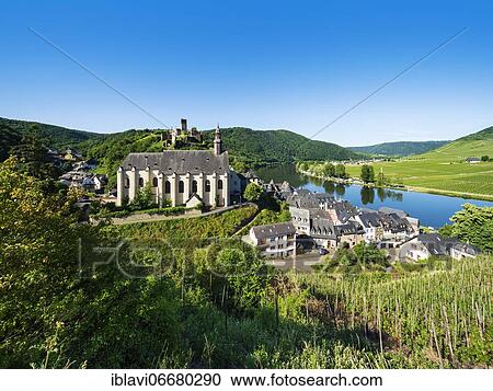 Stock Image - Wiwing village Beilstein at the river Moselle with Carmelite church and castle ruin Metternich surrounded by vineyards, Beilstein, Rhineland-Palatinate, Germany, Europe. Fotosearch