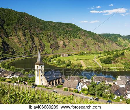 Wiwing village Bremm at the Moselle with St. Laurentius church, in the back the monastery ruin Stuben, Bremm, Rhineland-Palatinate, Germany, Europe View Large Photo Image Stock Photo - Wiwing village Bremm at the Moselle with St. Laurentius church, in the back the monastery ruin Stuben, Bremm, Rhineland-Palatinate, Germany, Europe. Fotosearch