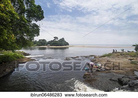 Woman washing her clothes, Lobe waterfalls, Kribi, Cameroon, Africa View Large Photo Image Stock Image - Woman washing her clothes, Lobe waterfalls, Kribi, Cameroon, Africa. Fotosearch