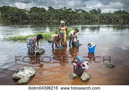 Women washing clothes by the river Ntem in the rainforest, Campo, Southern Region, Cameroon, Africa View Large Photo Image Stock Photograph - Women washing clothes by the river Ntem in the rainforest, Campo, Southern Region, Cameroon, Africa. Fotosearch