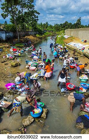 Women washing clothes in a river bed, City of Sao Tome, Sao Tome and Principe, Atlantic ocean, Africa View Large Photo Image Stock Image - Women washing clothes in a river bed, City of Sao Tome, Sao Tome and Principe, Atlantic ocean, Africa. Fotosearch