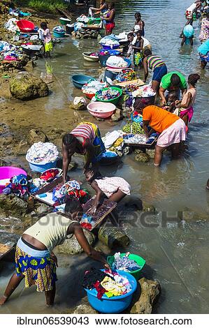 Women washing clothes in a river bed, City of Sao Tome, Sao Tome and Principe, Atlantic ocean, Africa View Large Photo Image Stock Image - Women washing clothes in a river bed, City of Sao Tome, Sao Tome and Principe, Atlantic ocean, Africa. Fotosearch