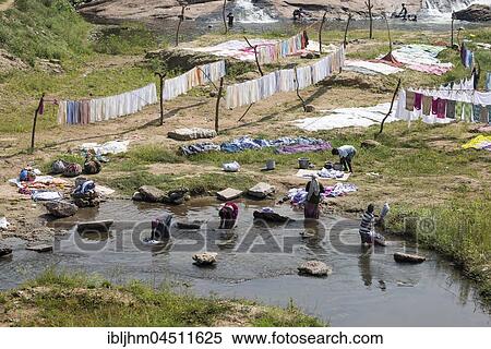 Women washing laundry in river, washing place, near Madurai, Tamil Nadu, India, Asia View Large Photo Image Stock Photography - Women washing laundry in river, washing place, near Madurai, Tamil Nadu, India, Asia. Fotosearch