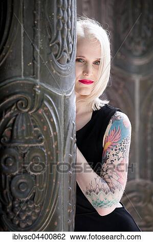 Young blond woman, tattooed View Large Photo Image Stock Image - Young blond woman, tattooed. Fotosearch