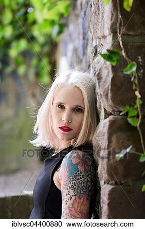 Young blond woman, tattooed View Large Photo Image Stock Image - Young blond woman, tattooed. Fotosearch