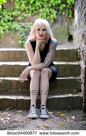 Young blond woman, tattooed View Large Photo Image Stock Photo - Young blond woman, tattooed. Fotosearch