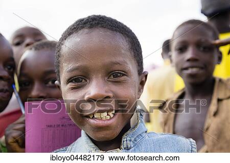 Young boy of a community living on islands on Lake Ruhondo near the Volcanoes National Park, Rwanda, Africa View Large Photo Image Stock Photo - Young boy of a community living on islands on Lake Ruhondo near the Volcanoes National Park, Rwanda, Africa. Fotosearch