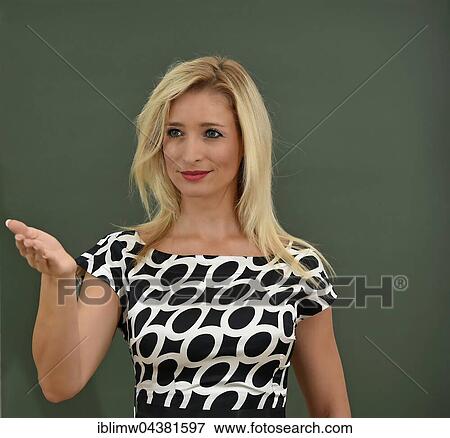 Young female teacher in front of blackboard View Large Photo Image Stock Photo - Young female teacher in front of blackboard. Fotosearch