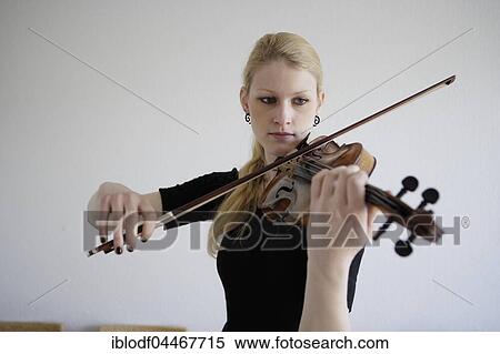 Young musician plays on the violin, Germany, Europe View Large Photo Image Stock Photography - Young musician plays on the violin, Germany, Europe. Fotosearch