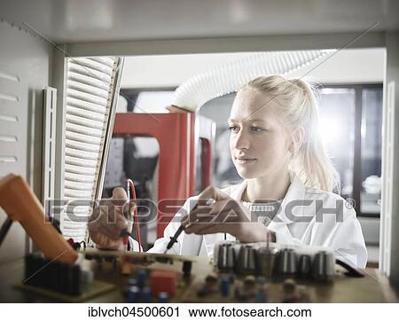Young woman with white lab coat measuring controller with meter, Austria, Europe View Large Photo Image Stock Image - Young woman with white lab coat measuring controller with meter, Austria, Europe. Fotosearch