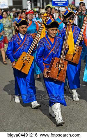Youth in traditional Deel clothes and horse-head fiddle, Morin chuur, Festival of the Mongolian national traditional costume, Ulaanbaatar, Mongolia, Asia View Large Photo Image Stock Photograph - Youth in traditional Deel clothes and horse-head fiddle, Morin chuur, Festival of the Mongolian national traditional costume, Ulaanbaatar, Mongolia, Asia. Fotosearch