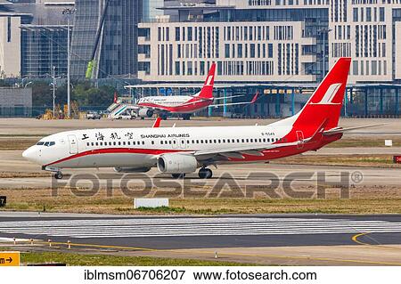 Stock Photo - A Boeing 737-800 of Shanghai Airlines with registration number B-5549 at Shanghai Airport, China, Asia. Fotosearch